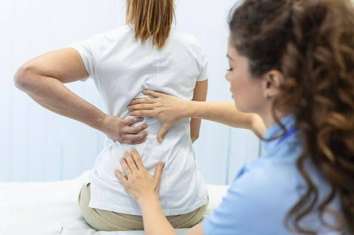 A chiropractor performing spinal adjustments on a patient to improve gut-brain health through chiropractic care, enhancing digestion and overall well-being. Perfect for those searching for the best chiropractor in Denver or looking for effective chiropractic and nutrition solutions.
