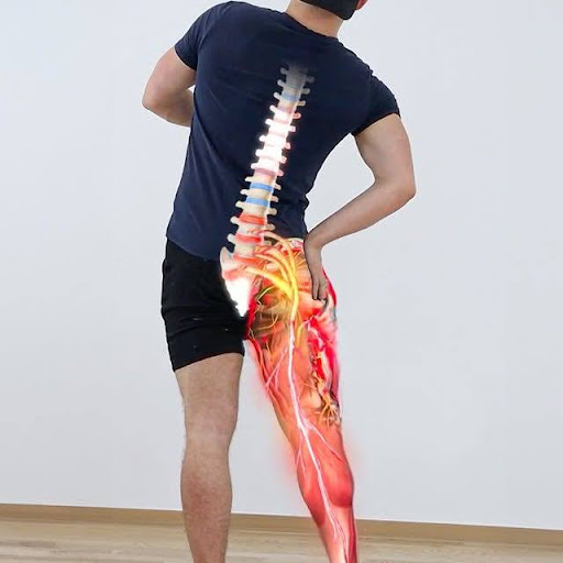 Person holding lower back and leg in pain, illustrating sciatica pain discomfort.